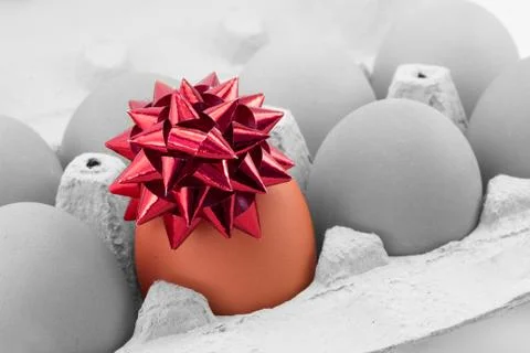 Colored egg with bow Stock Photos