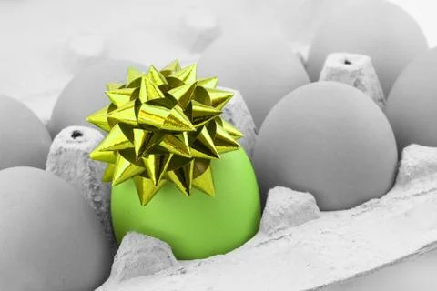 Colored egg with bow Stock Photos