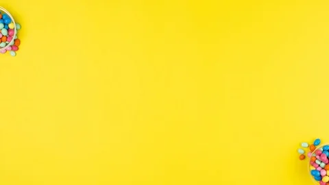 Colored eggs and colored letters Happy Easter on a yellow background Stock Footage 127103305