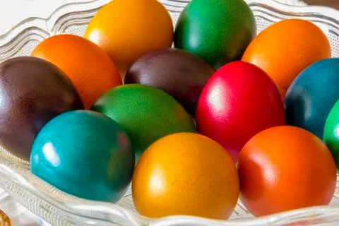 Colored eggs in the basket. Stock Photos