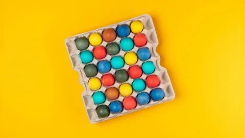 Colored eggs in a cardboard box.Stop motion animation Stock Footage 127103746