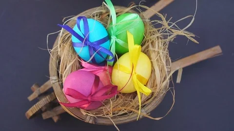 Colored Eggs in the Cart, They Put a Straw Hat Stock Footage 73614322