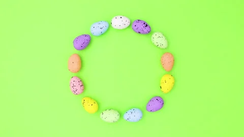 Colored Eggs for Easter make circle and move on green theme . Stop motion Stock Footage 149331666