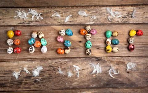 Colored eggs in form of the word Easter Stock Photos