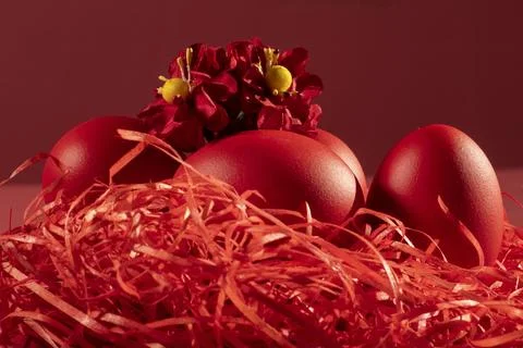 Colored eggs symbolize Easter in shades of red Stock Photos