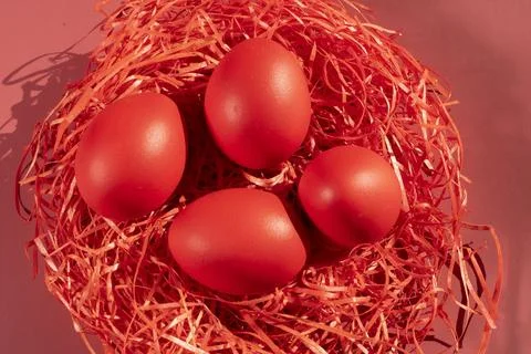 Colored eggs symbolize Easter in shades of red Stock Photos