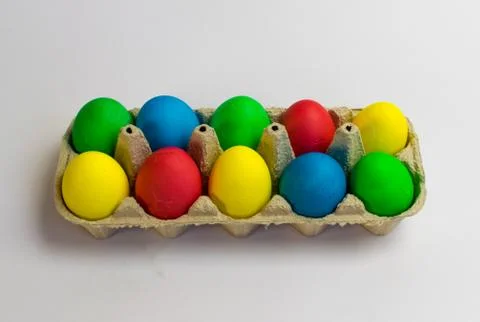 Colored eggs in a tray Easter is coming soon Stock Photos
