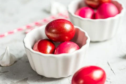 .Colored eggs in a white bowl on the Easter holiday Stock Photos
