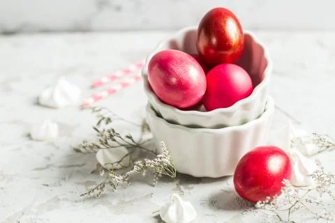 .Colored eggs in a white bowl on the Easter holiday Stock Photos