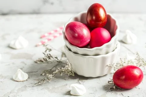 .Colored eggs in a white bowl on the Easter holiday Stock Photos