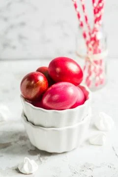 .Colored eggs in a white bowl on the Easter holiday Stock Photos