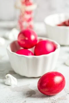 .Colored eggs in a white bowl on the Easter holiday Stock Photos
