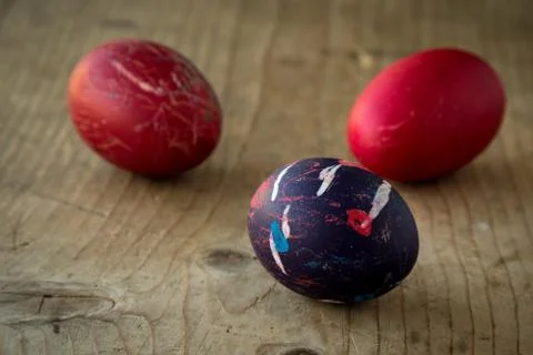 Colored eggs on wooden table Stock Photos
