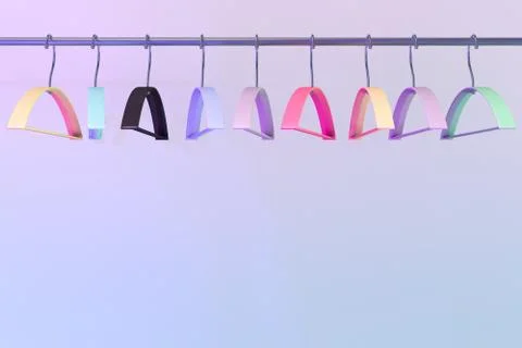 Colored empty hangers in the wardrobe Stock-Fotos