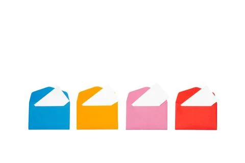 Colored envelopes with a white paper inside on a white background with copy s Stock Photos