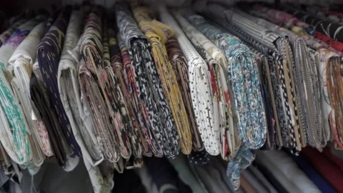 Colored fabrics in rolls on store shelves Stock-Footage 169727139