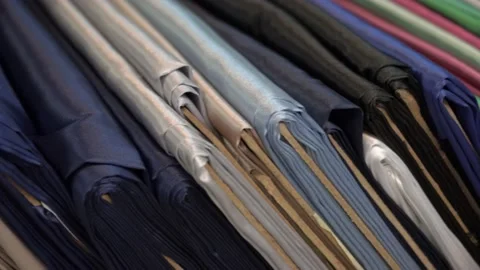 Colored fabrics in rolls on store shelves Stock Footage 169727215