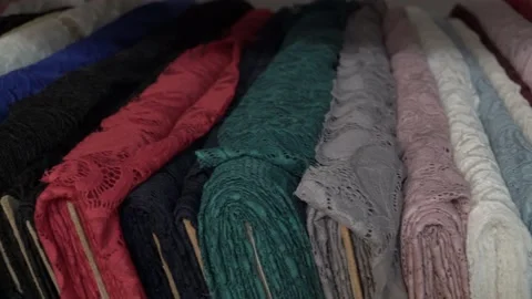 Colored fabrics in rolls on store shelves Stock Footage 169727544