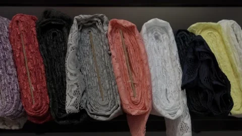 Colored fabrics in rolls on store shelves Stock Footage 169727554
