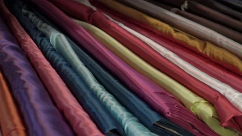 Colored fabrics in rolls on store shelves Stock Footage 169727586
