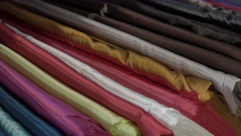 Colored fabrics in rolls on store shelves Stock Footage 169727899