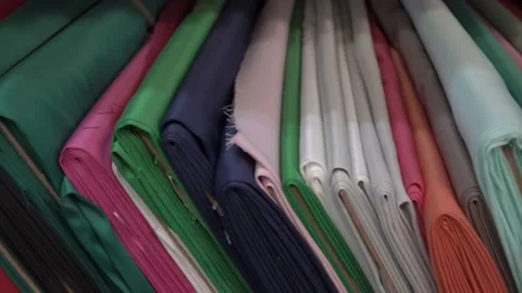 Colored fabrics in rolls on store shelves Stock Footage 169727926