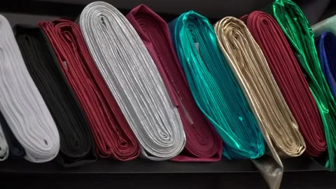 Colored fabrics in rolls on store shelves Stock Footage 169727929