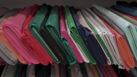 Colored fabrics in rolls on store shelves Stock Footage 169727953