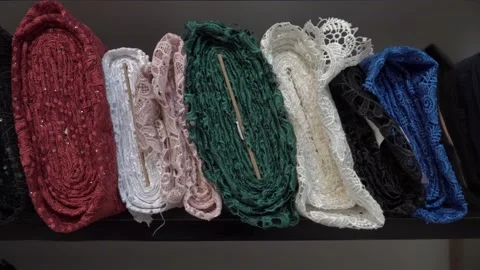 Colored fabrics in rolls on store shelves Stock Footage 169728186