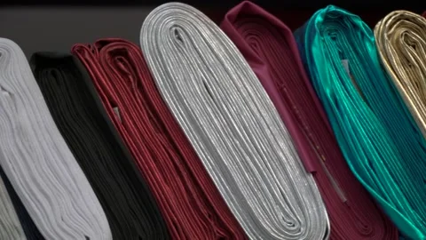 Colored fabrics in rolls on store shelves Video stock 169728221