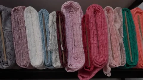 Colored fabrics in rolls on store shelves Stock Footage 169728817