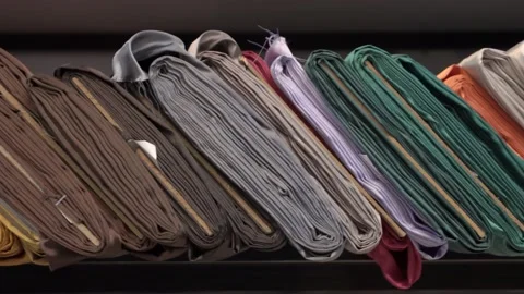 Colored fabrics in rolls on store shelves Stock Footage 169728877