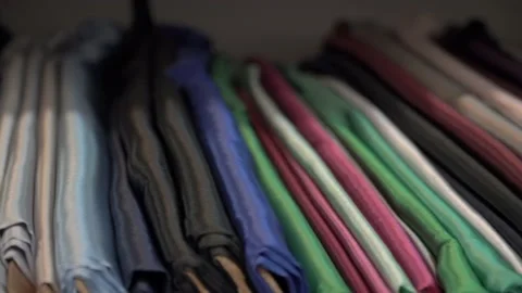 Colored fabrics in rolls on store shelves Stock Footage 169728916