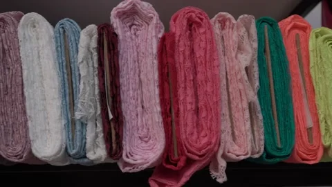 Colored fabrics in rolls on store shelves Stock Footage 169728946
