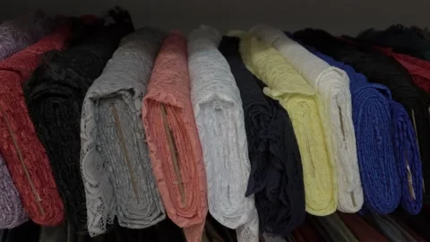 Colored fabrics in rolls on store shelves Stock Footage 169728951