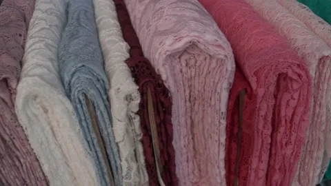 Colored fabrics in rolls on store shelves Stock Footage 169729222