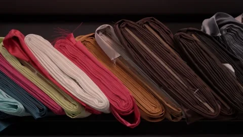 Colored fabrics in rolls on store shelves Stock Footage 169729288