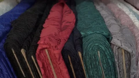 Colored fabrics in rolls on store shelves Stock Footage 169729348