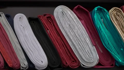 Colored fabrics in rolls on store shelves Stock Footage 169729350