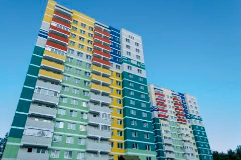 Colored facade wall of a modern residential building with a view from the bot Stock Photos