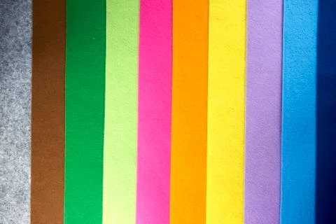 Colored felt texture background, grey, brrown, green, lime, pink, orange, yel Stock Photos