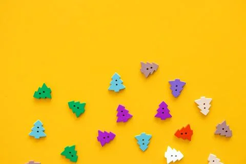 Colored figures in the form of Christmas tree on a yellow background Stock Photos