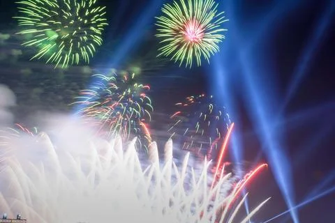 Colored firework background with free space for text. Colorful fireworks at.. Illustrazione stock