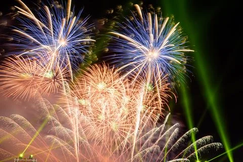 Colored firework background with free space for text. Colorful fireworks at.. Illustrazione stock