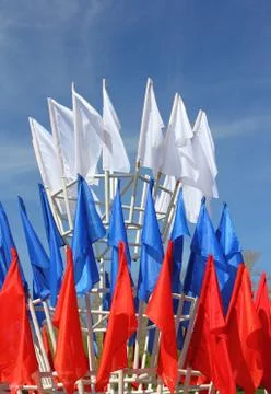 Colored flags on a blue sky background Stock-Fotos