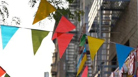 Colored flags hanging outside in NY city 動画素材 116689519
