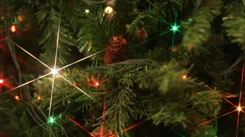 Colored flashing lights in Christmas tree, six point cross screen filter Stock Footage 41381409