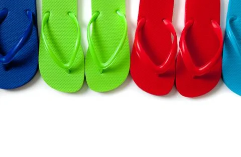 Colored flipflops on a white background Stock Photos