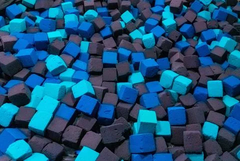 Colored foam rubber cubes background. Stock Photos