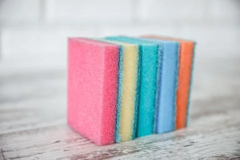 Colored foam rubber sponge for cleaning and washing dishes Stock Photos